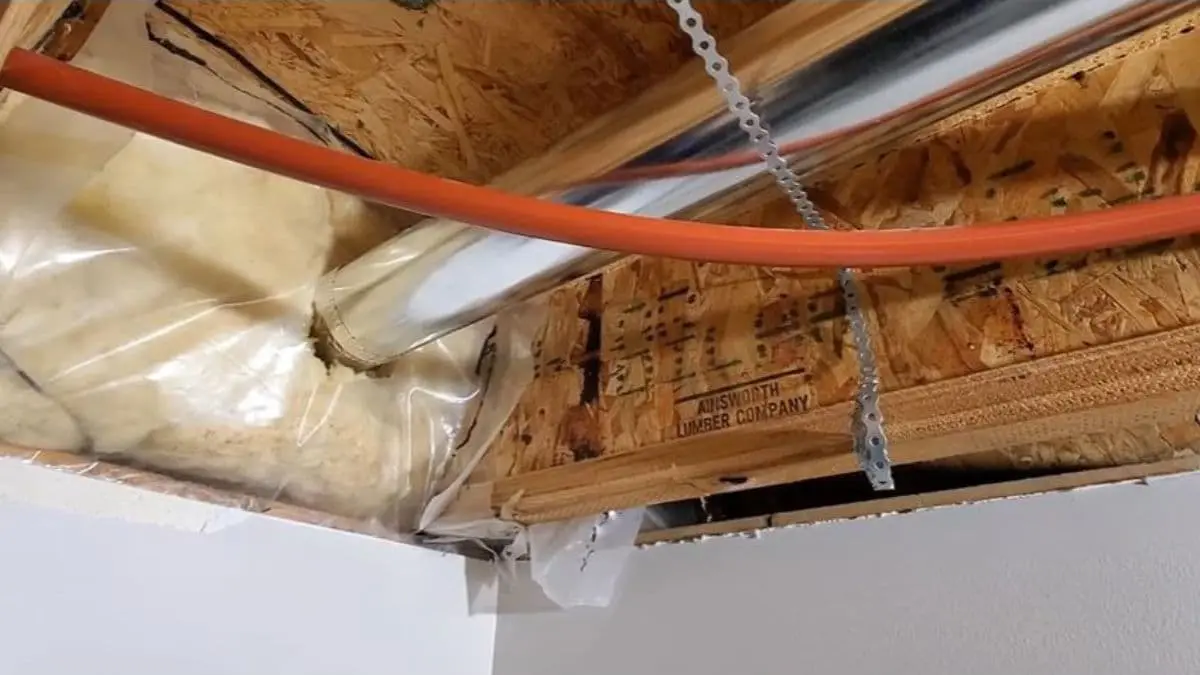dryer vent through floor joist