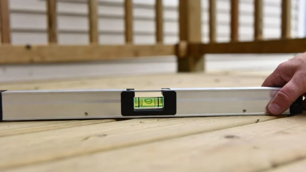 checking porch floor level with spirit level