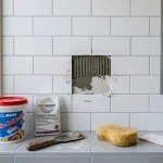 how to fix bathroom tile that fell off