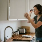 cabinet pulling away from wall